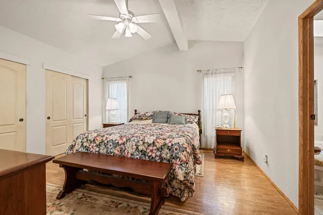 a bedroom with a bed and a table