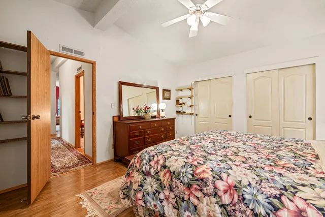 a bedroom with a bed and a dresser