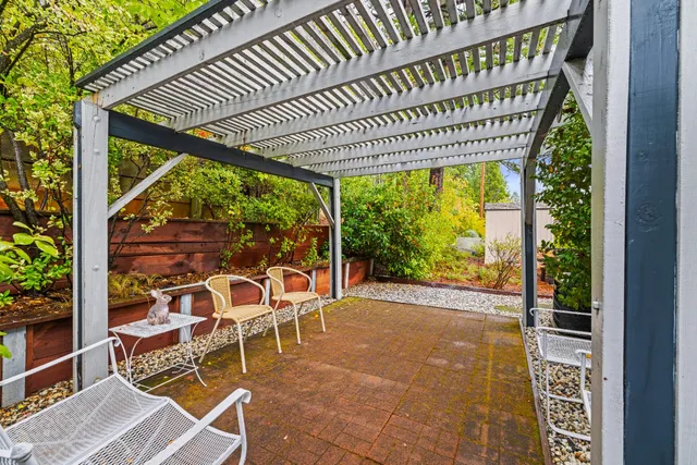 a view of a chairs and table in the patio