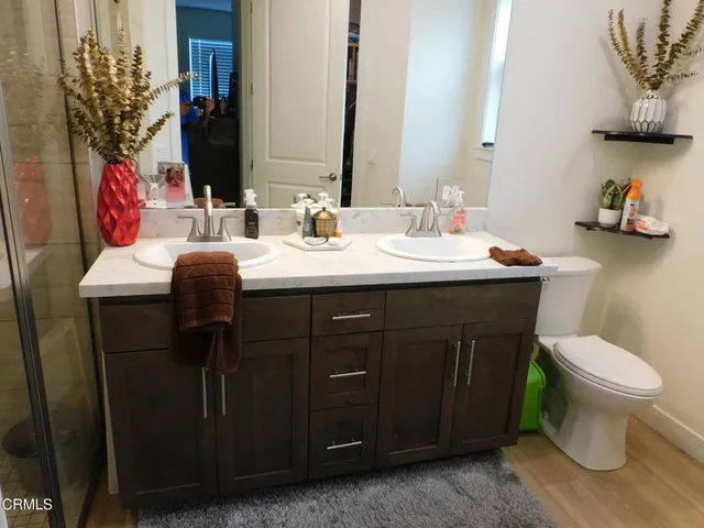 a view of walk in closet with clothes