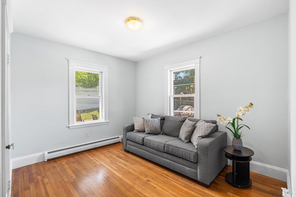 3 Fitz Road Peabody, MA 01960 - Photo 19 of 34 a living room with furniture and a potted plant