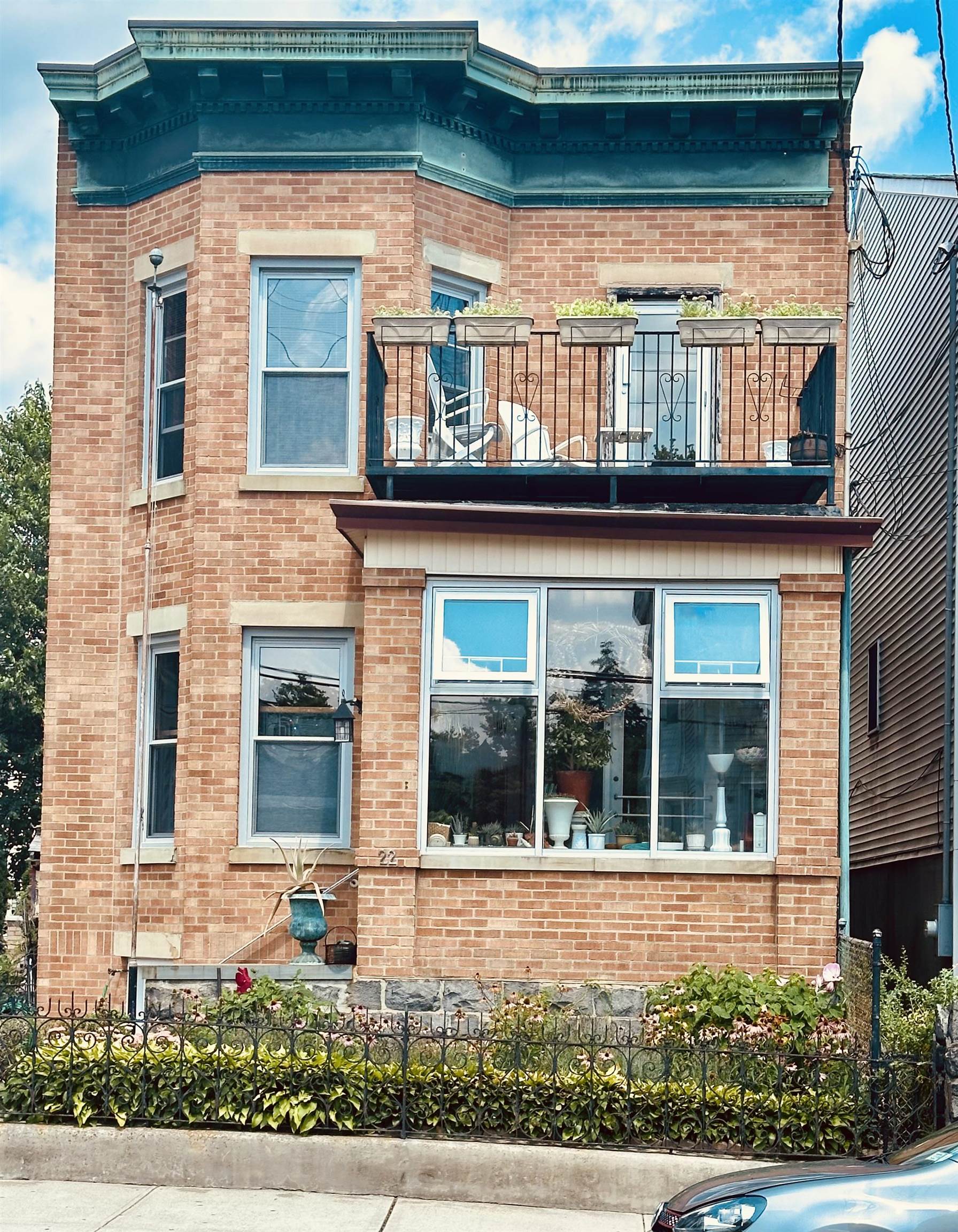 22 46th Street, Unit 2 Weehawken, NJ 07086 - Photo 1 of 7 a view of a brick house with large windows