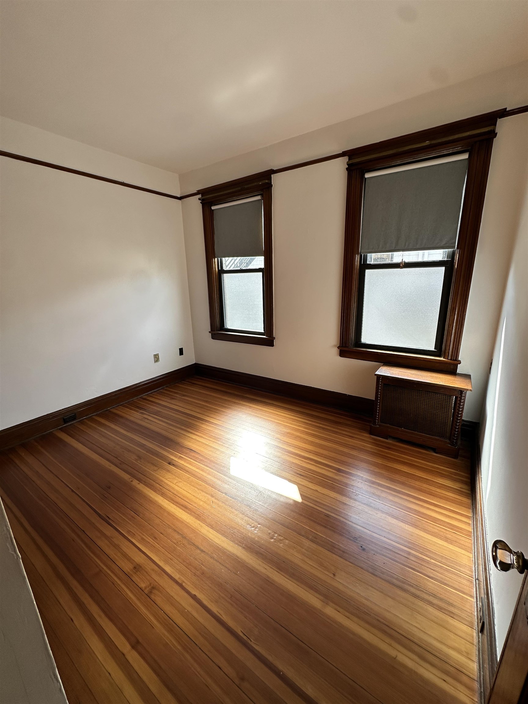 22 46th Street, Unit 2 Weehawken, NJ 07086 - Photo 4 of 7 a view of room with window and wooden floor