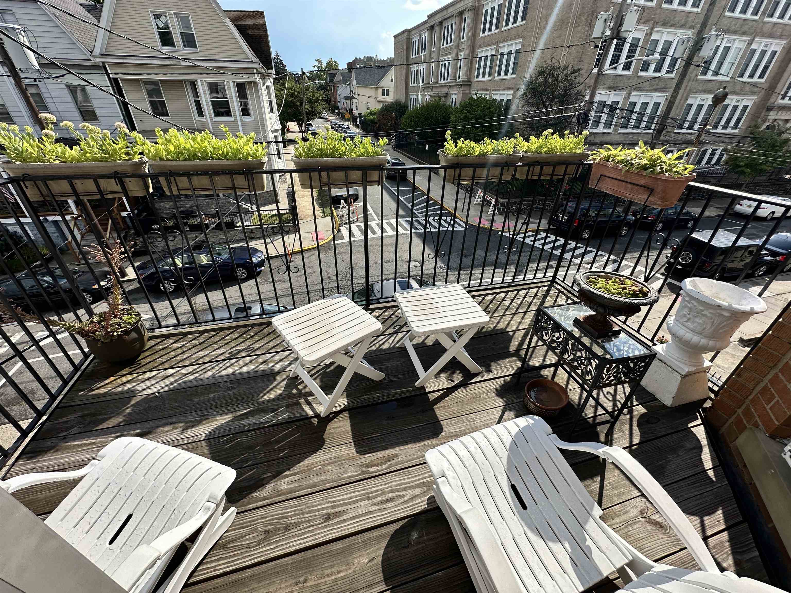 22 46th Street, Unit 2 Weehawken, NJ 07086 - Photo 7 of 7 a view of a chairs and table on the deck