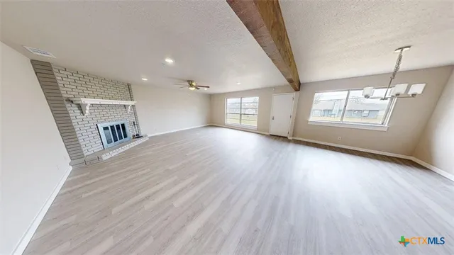 a view of livingroom with hardwood floor and window