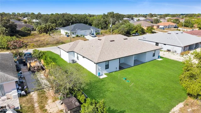 aerial view of a house with a ocean view