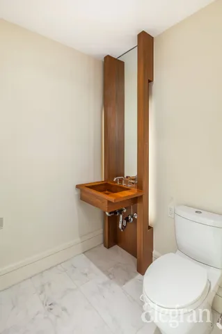 a bathroom with a sink a mirror and bathtub