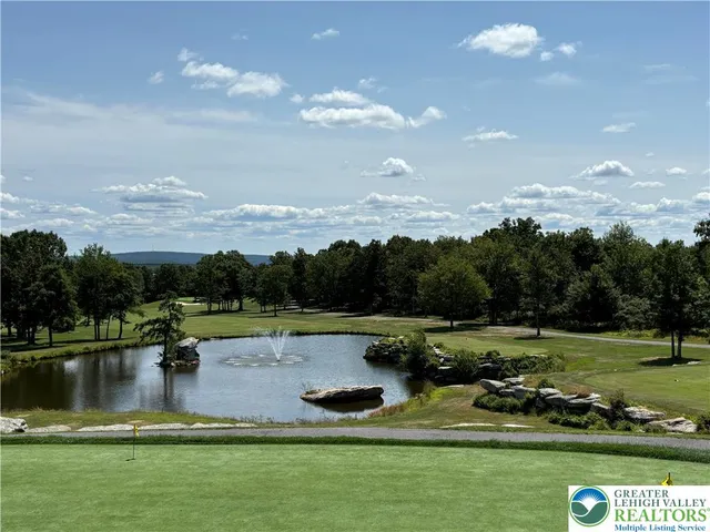 a view of a lake with a yard