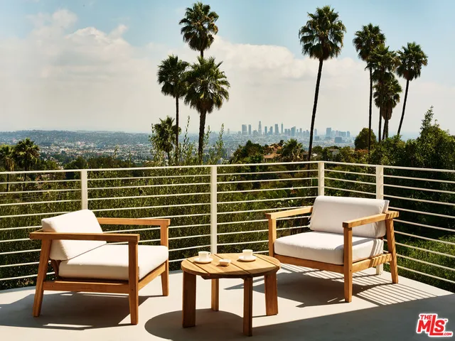 a view of a chairs and table in the terrace