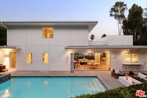 a view of a car park in front of house