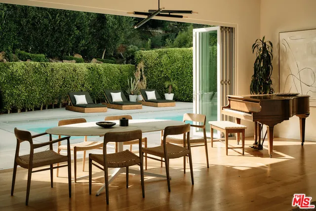 a dining area with furniture and outdoor view