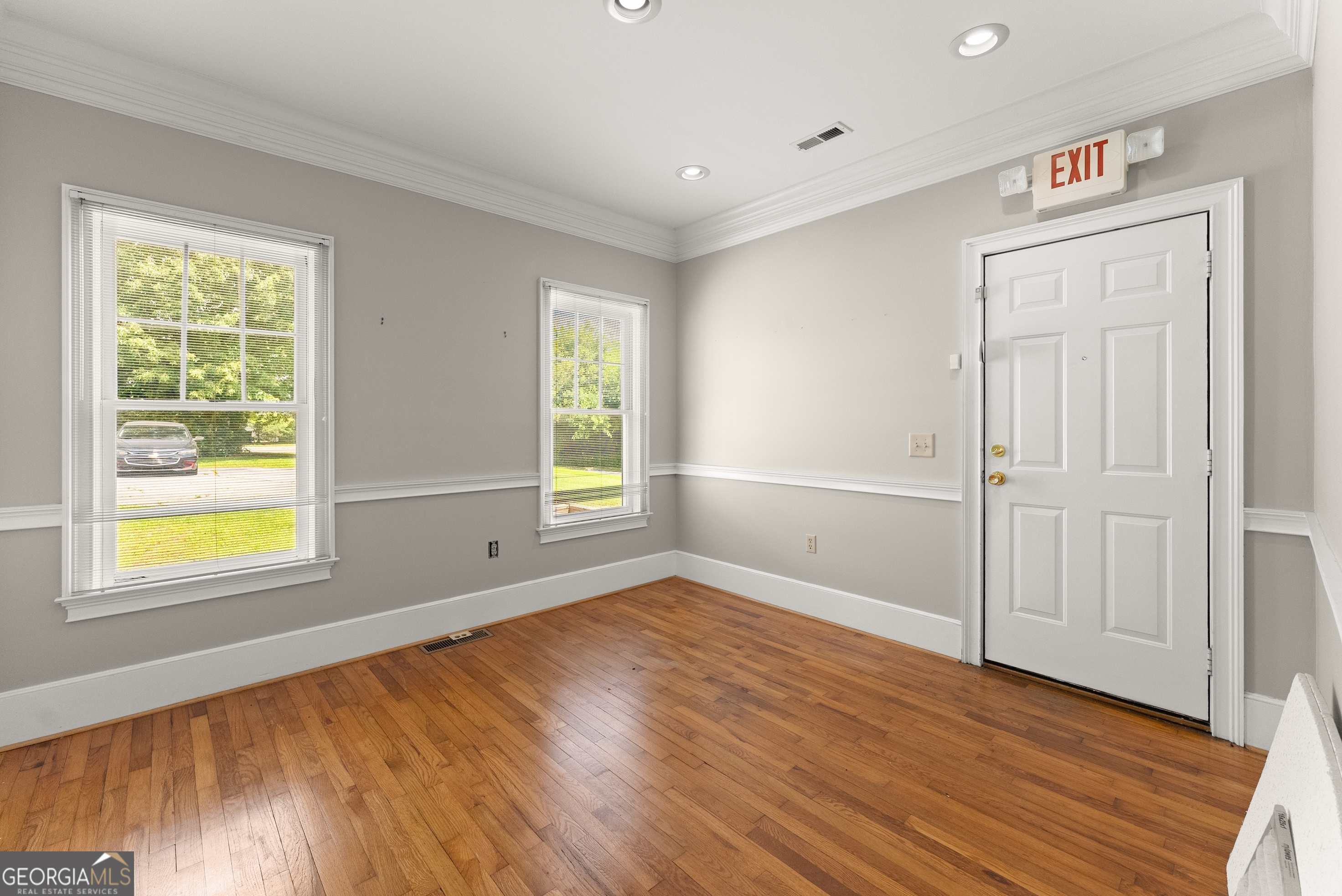 592 North Main Street Cornelia, GA 30531 - Photo 15 of 41 a view of an empty room with wooden floor and a window