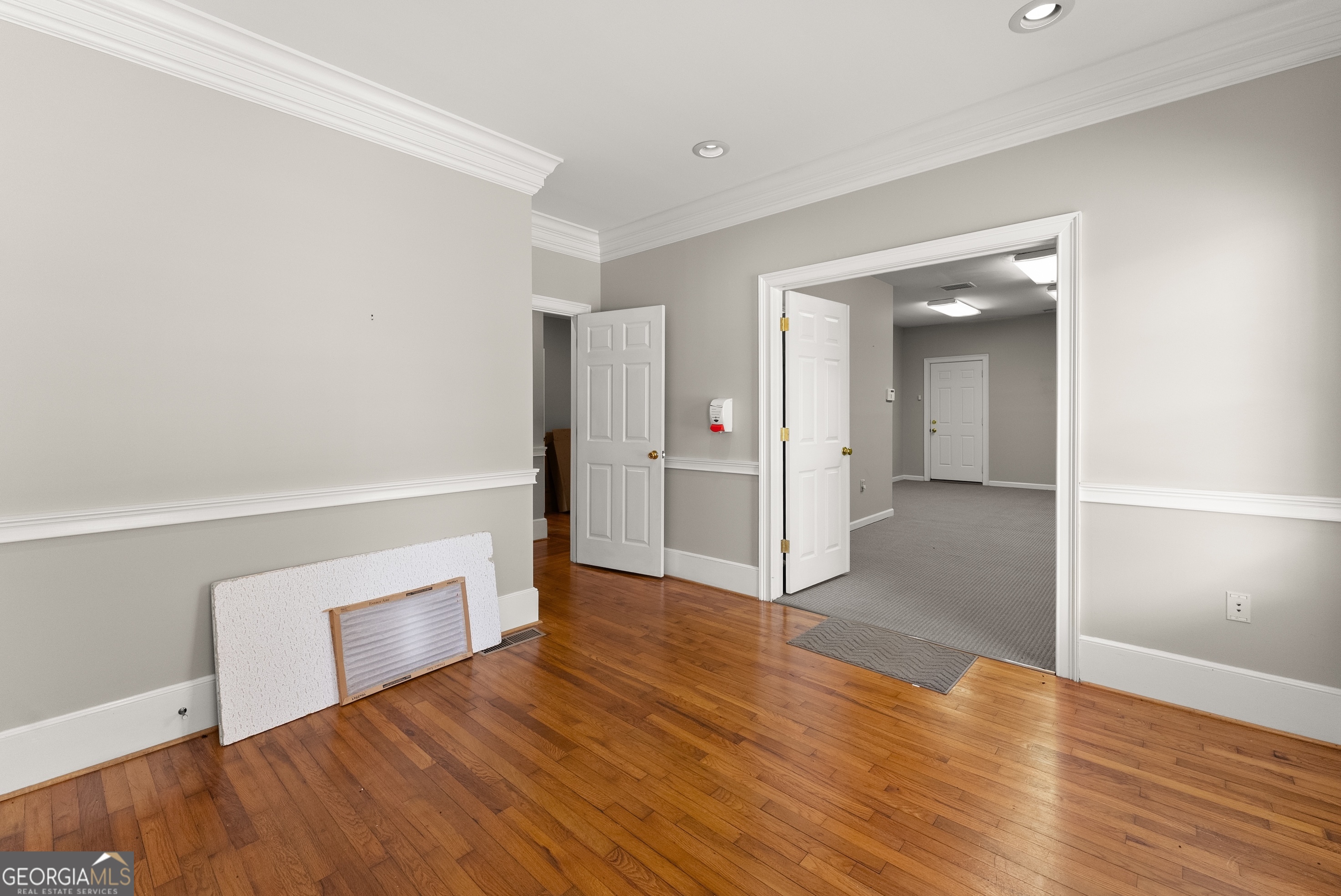592 North Main Street Cornelia, GA 30531 - Photo 16 of 41 wooden floor in an empty room with a window