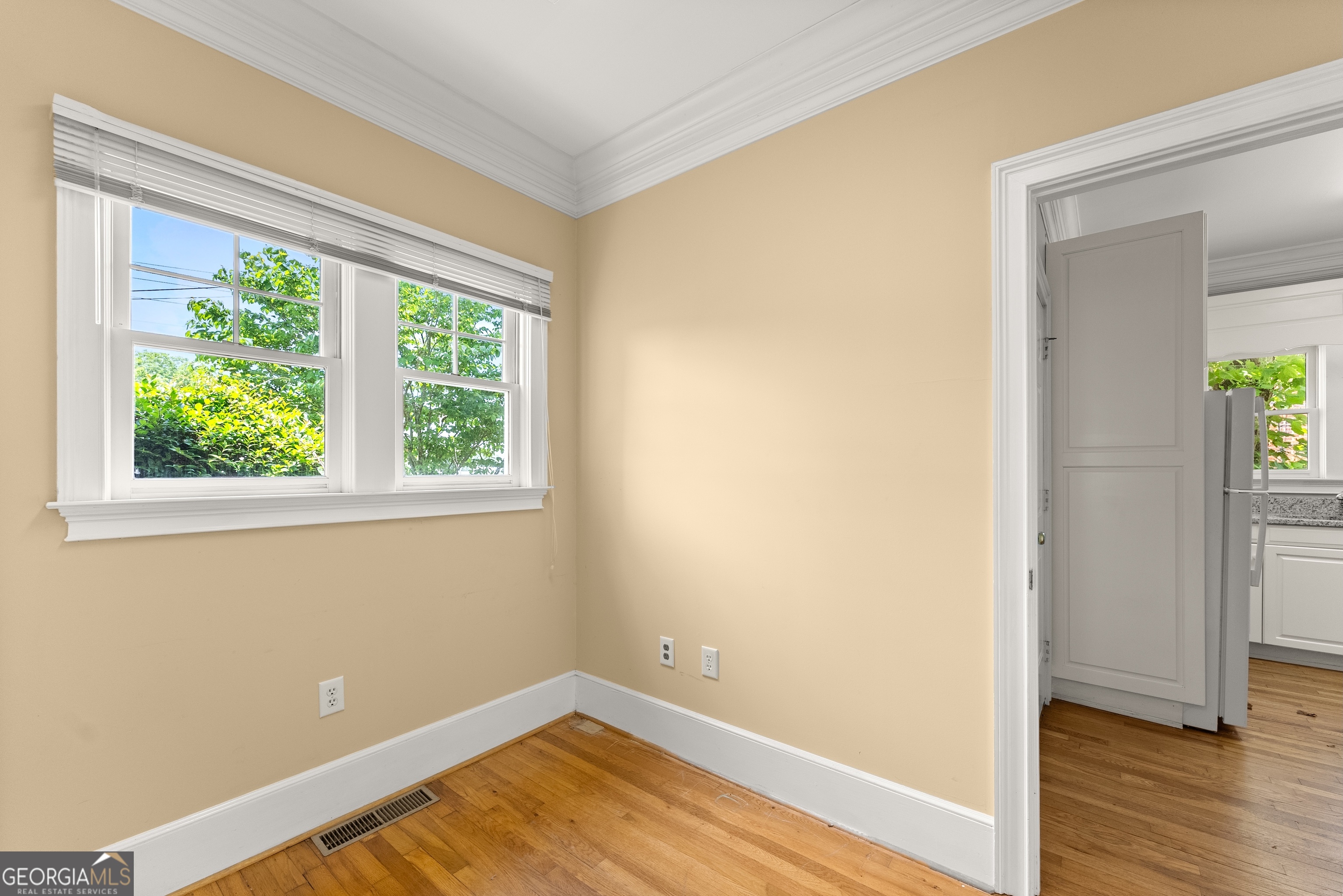 592 North Main Street Cornelia, GA 30531 - Photo 20 of 41 an empty room with wooden floor and windows