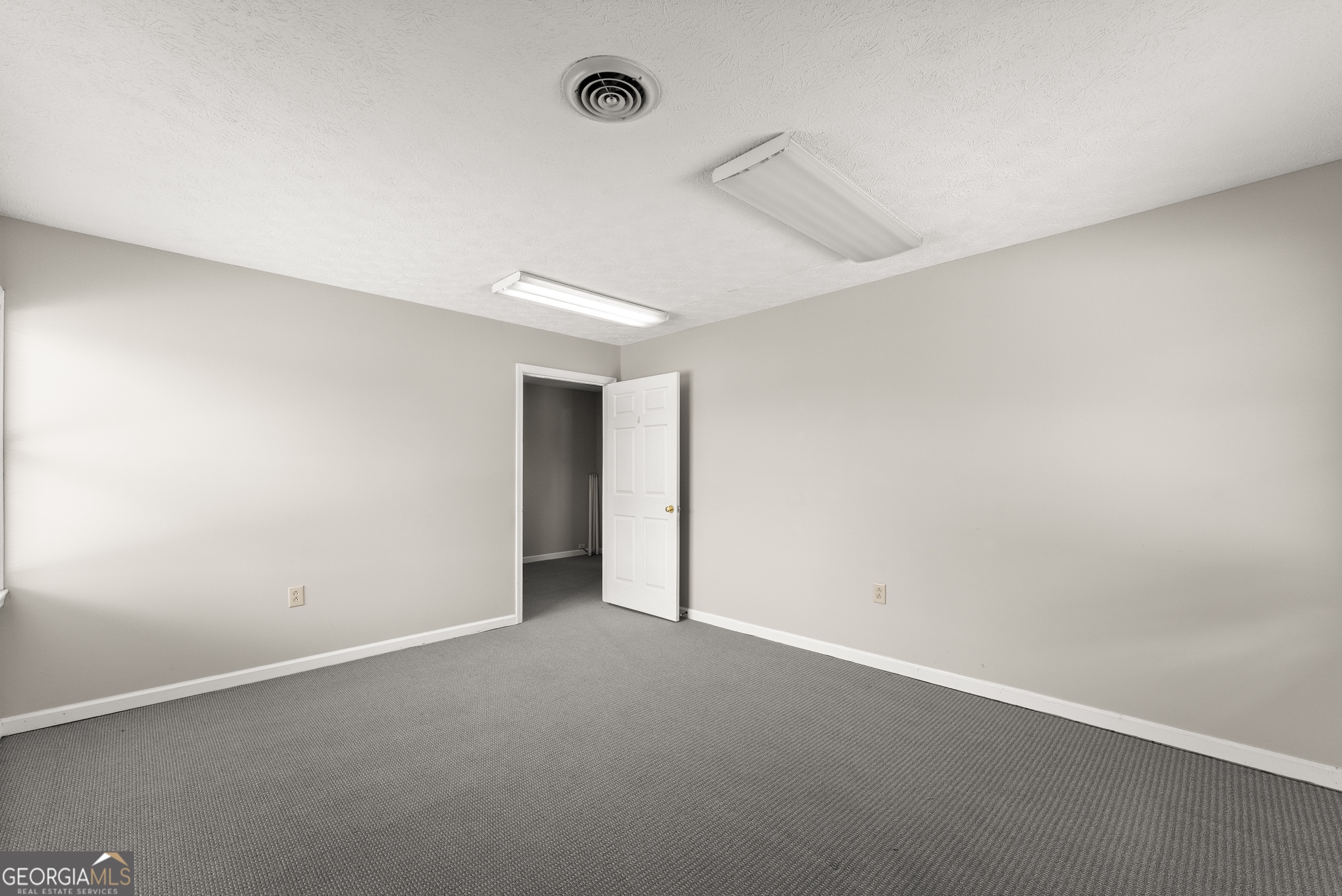 592 North Main Street Cornelia, GA 30531 - Photo 26 of 41 an empty room with ceiling fan and windows