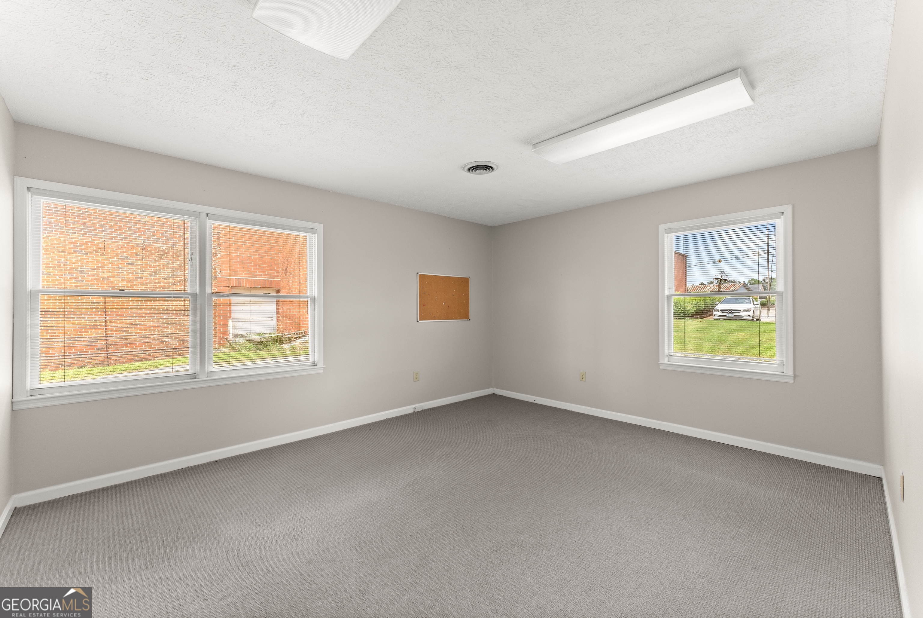 592 North Main Street Cornelia, GA 30531 - Photo 29 of 41 an empty room with windows