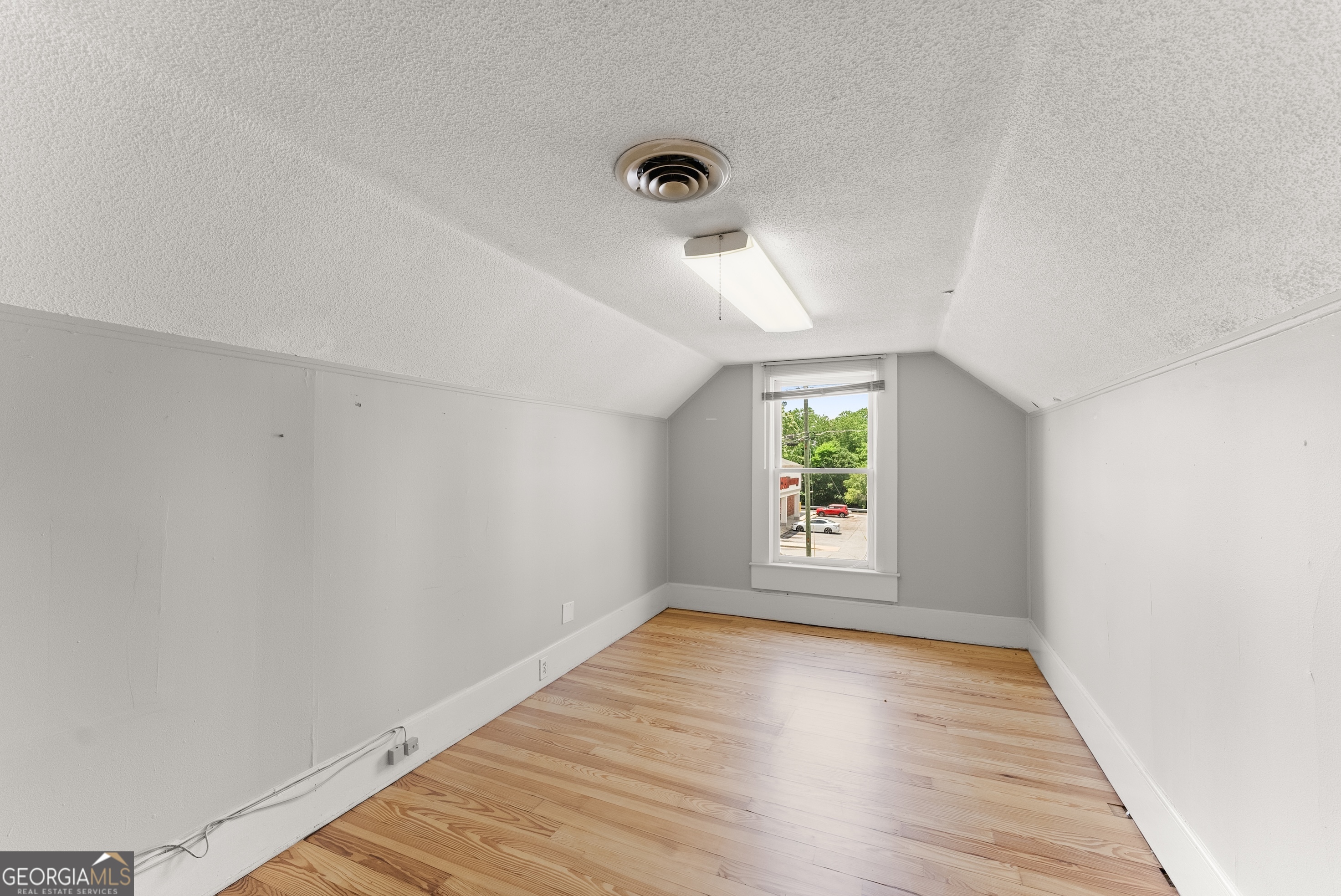592 North Main Street Cornelia, GA 30531 - Photo 31 of 41 wooden floor in an empty room with a window