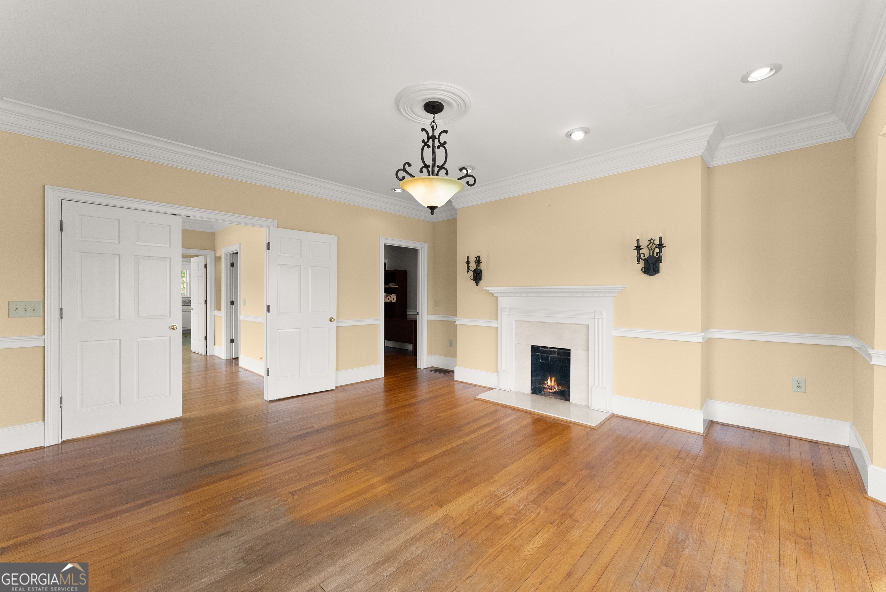 592 North Main Street Cornelia, GA 30531 - Photo 7 of 41 a view of a livingroom with wooden floor a fireplace and windows