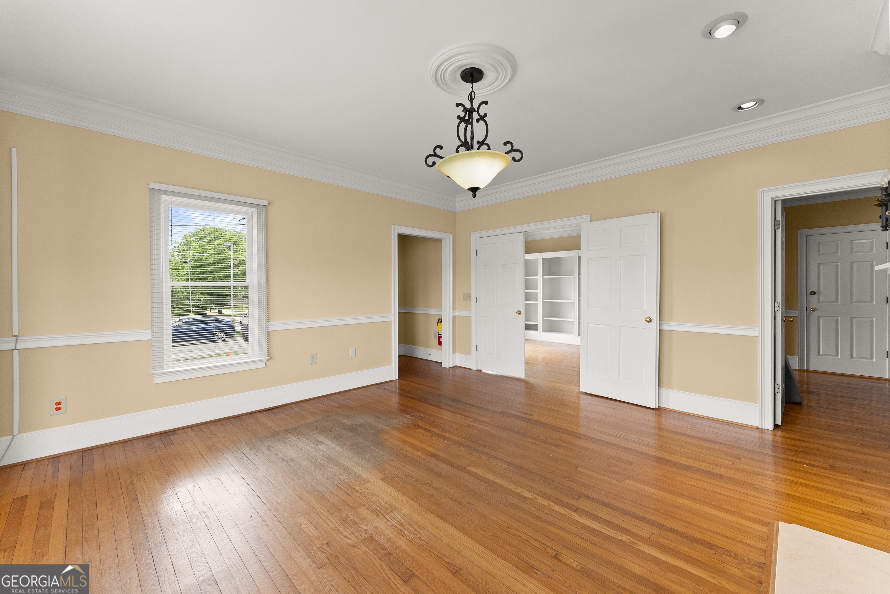 592 North Main Street Cornelia, GA 30531 - Photo 8 of 41 a view of an empty room with wooden floor and a window