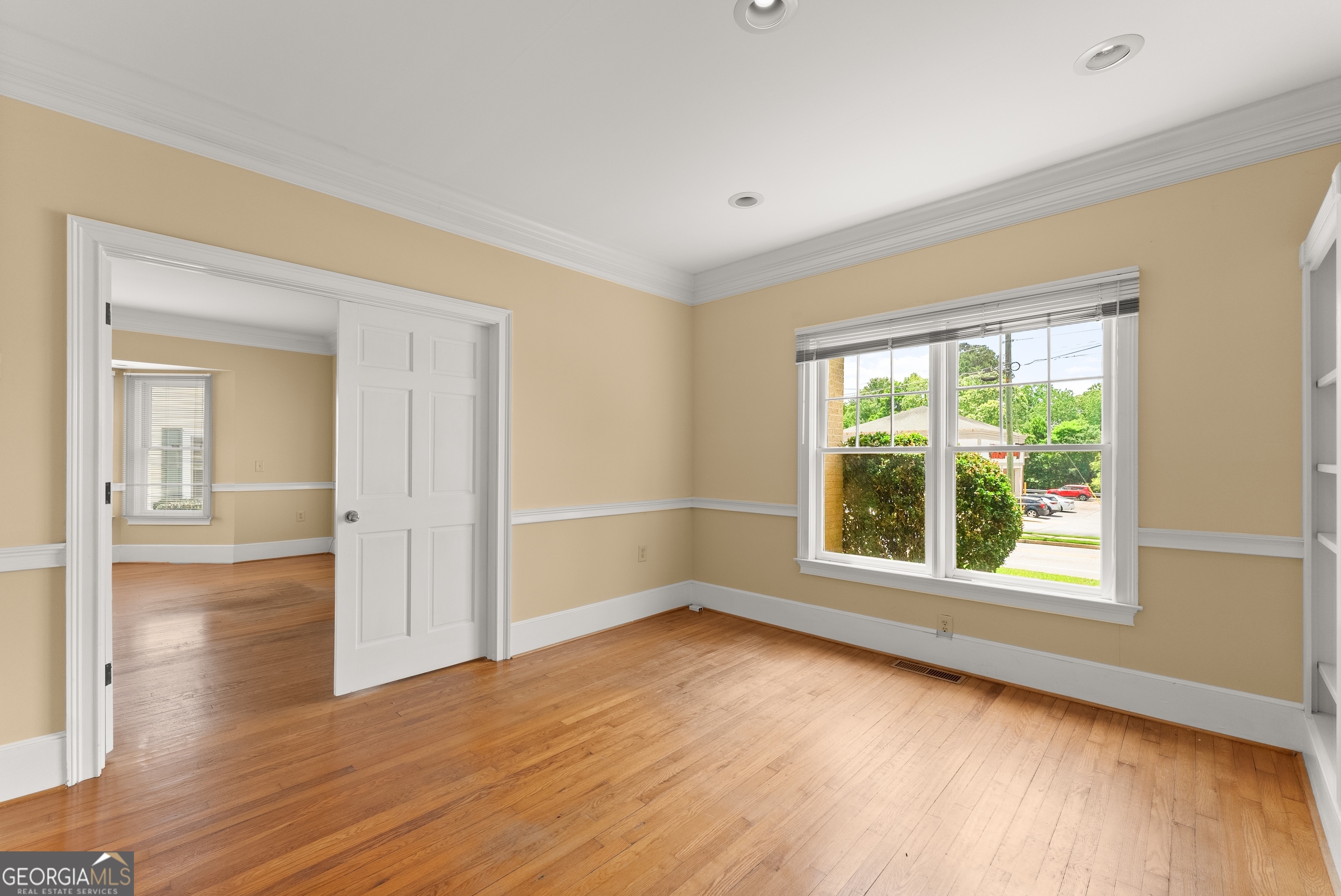 592 North Main Street Cornelia, GA 30531 - Photo 9 of 41 an empty room with wooden floor and windows