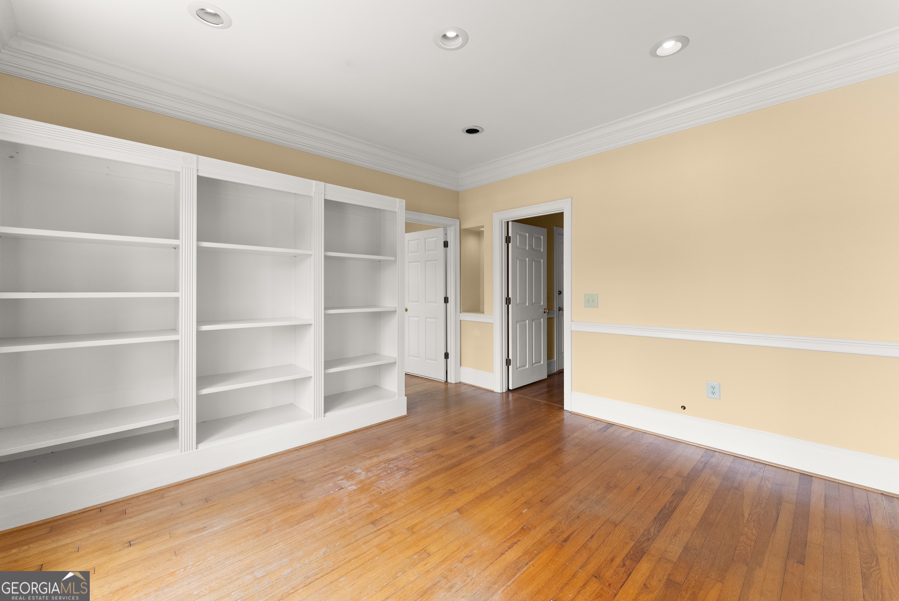 592 North Main Street Cornelia, GA 30531 - Photo 10 of 41 a view of an empty room with wooden floor and a window
