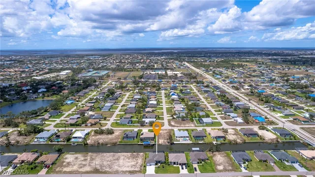 an aerial view of residential building and lake