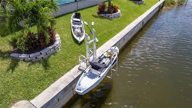 a view of swimming pool with a garden and seating area