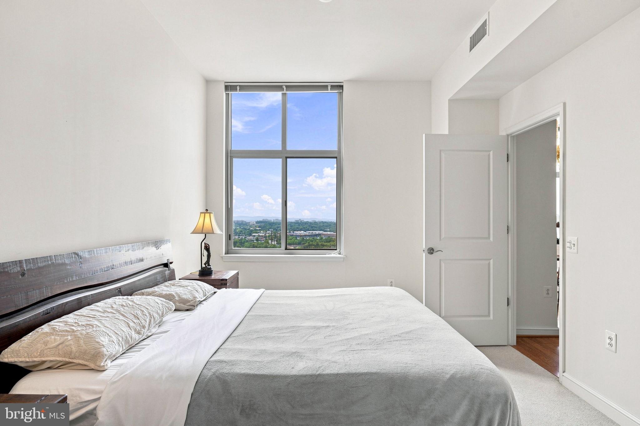 11990 Market Street, Unit 1514 Reston, VA 20190 - Photo 29 of 78 Primary bedroom with attached bathroom