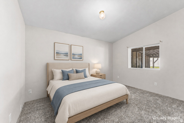 312 Harriger Way Layton, UT 84041 - Photo 13 of 36 Carpeted flooring, vaulted ceiling, and a single window