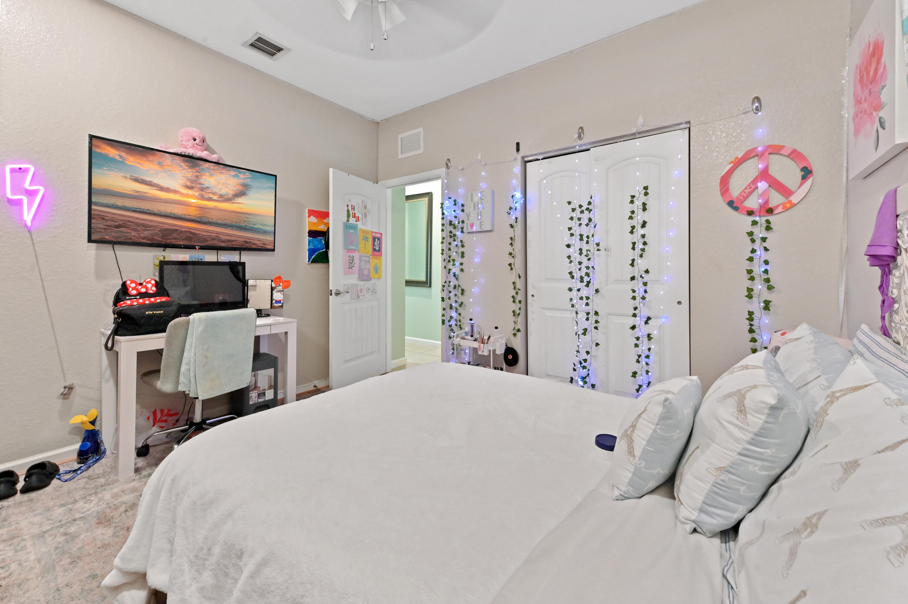 4848 Pond Pine Way Greenacres, FL 33463 - Photo 11 of 14 a bedroom with a bed and a window
