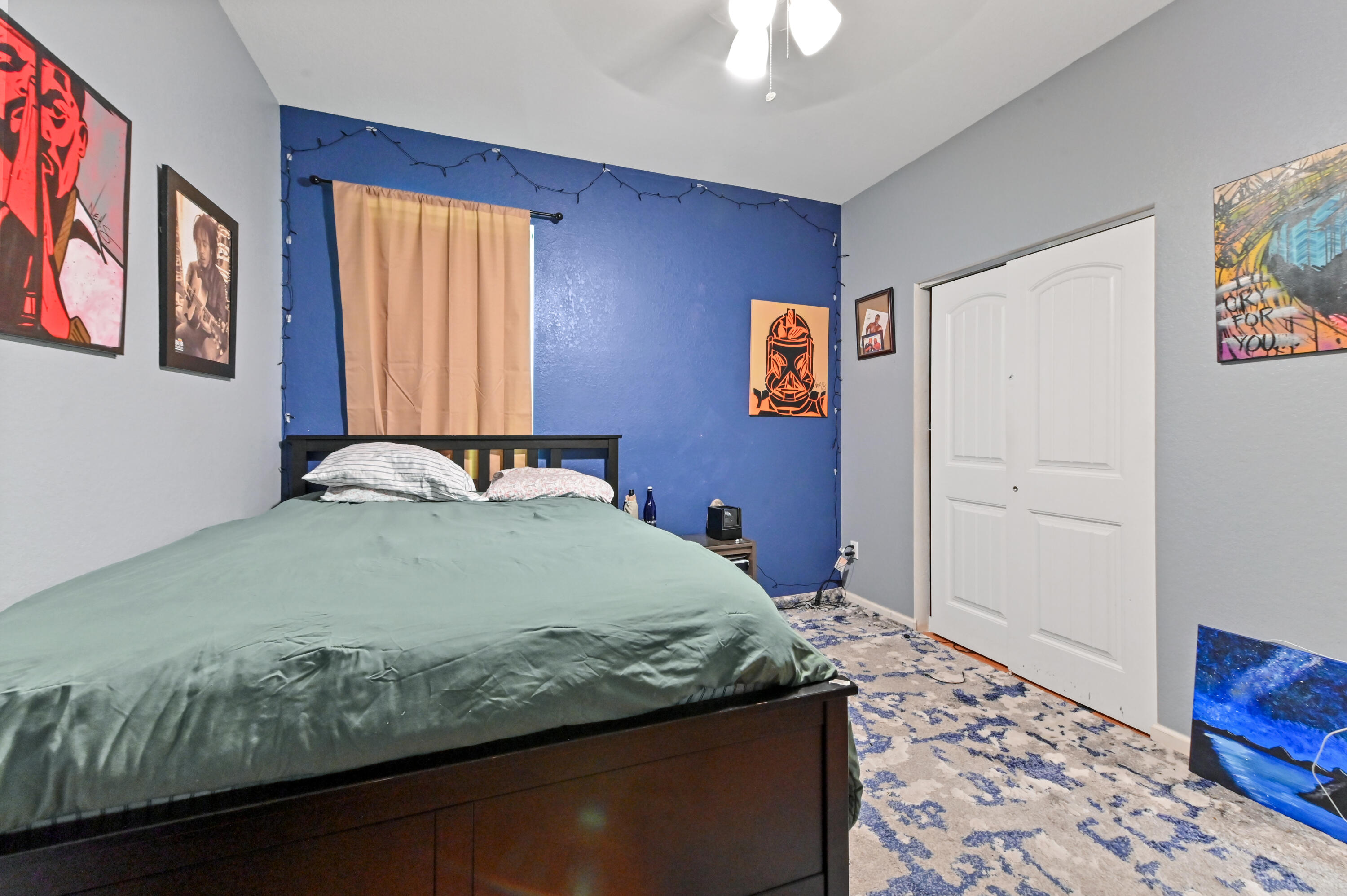 4848 Pond Pine Way Greenacres, FL 33463 - Photo 12 of 14 a bedroom with a bed and wooden floor
