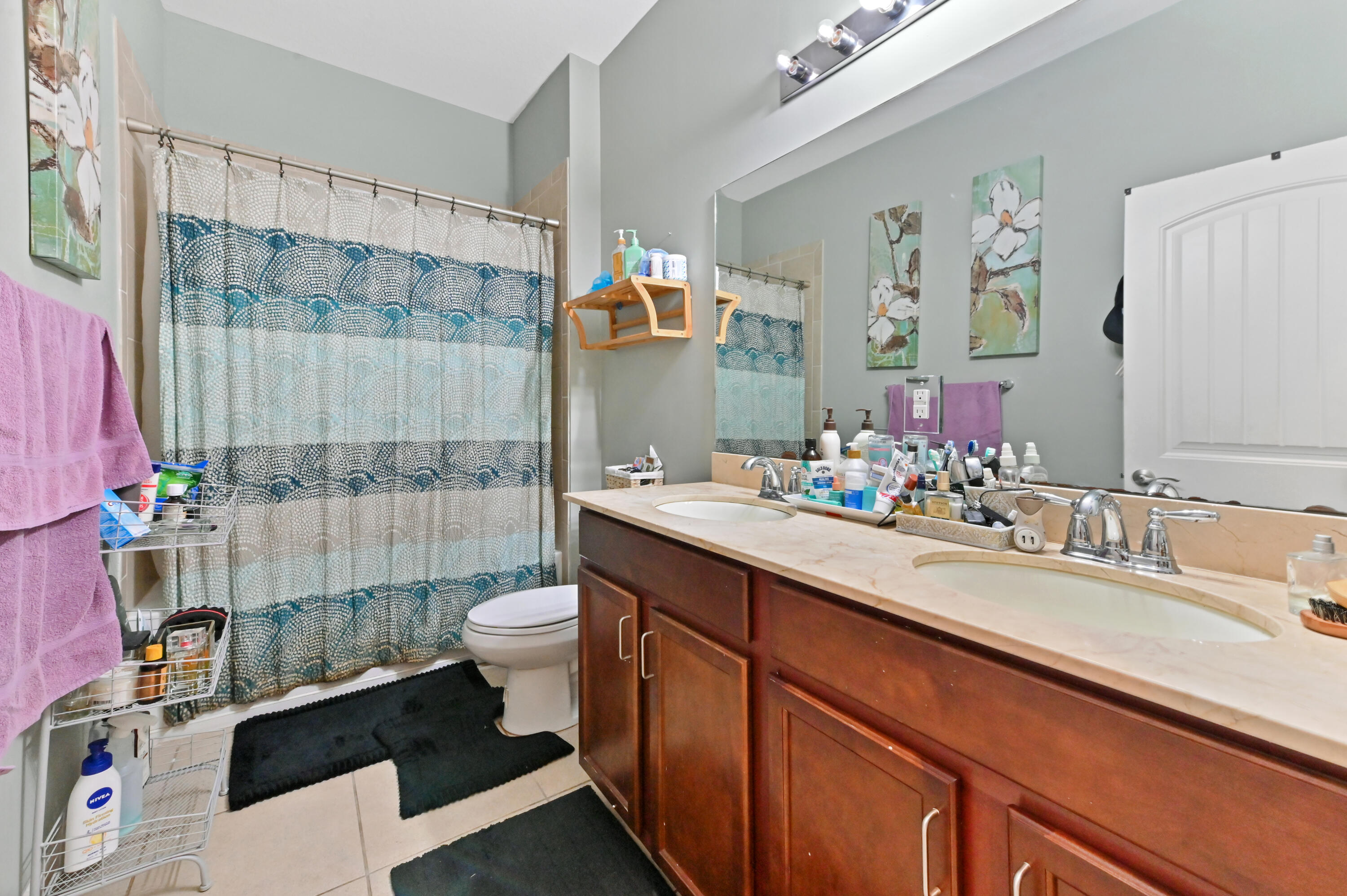 4848 Pond Pine Way Greenacres, FL 33463 - Photo 13 of 14 a bathroom with a double vanity sink toilet and shower