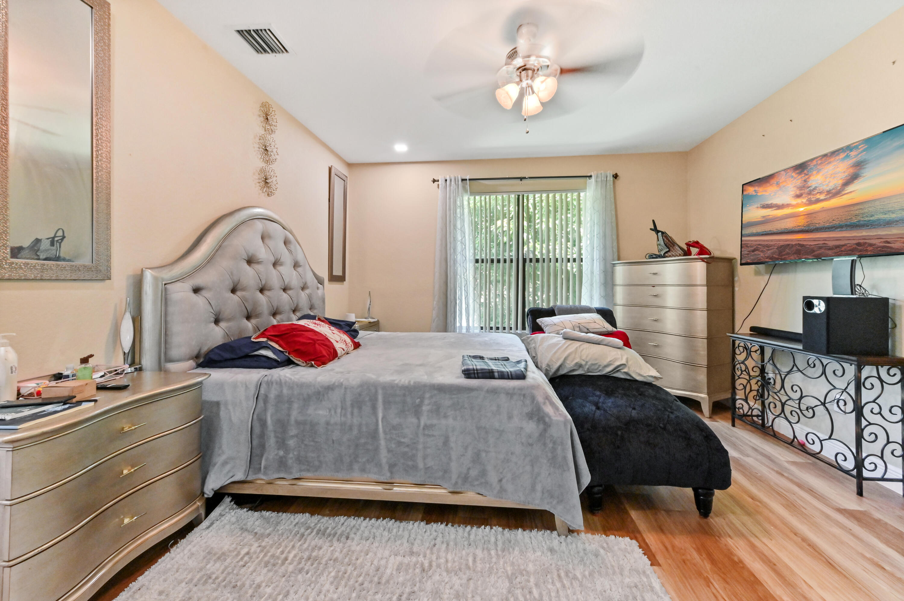 4848 Pond Pine Way Greenacres, FL 33463 - Photo 14 of 14 a bedroom with a bed dresser and a window