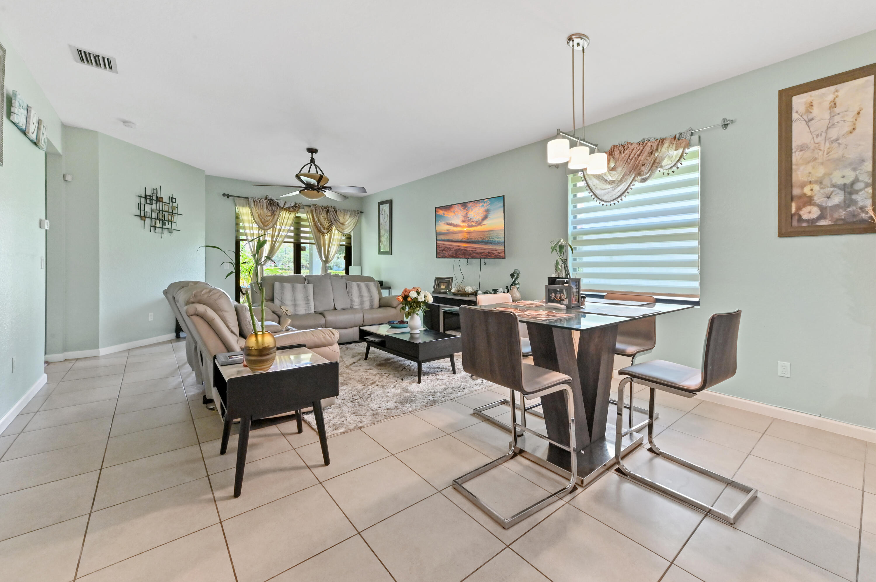 4848 Pond Pine Way Greenacres, FL 33463 - Photo 7 of 14 a view of a dining room with furniture