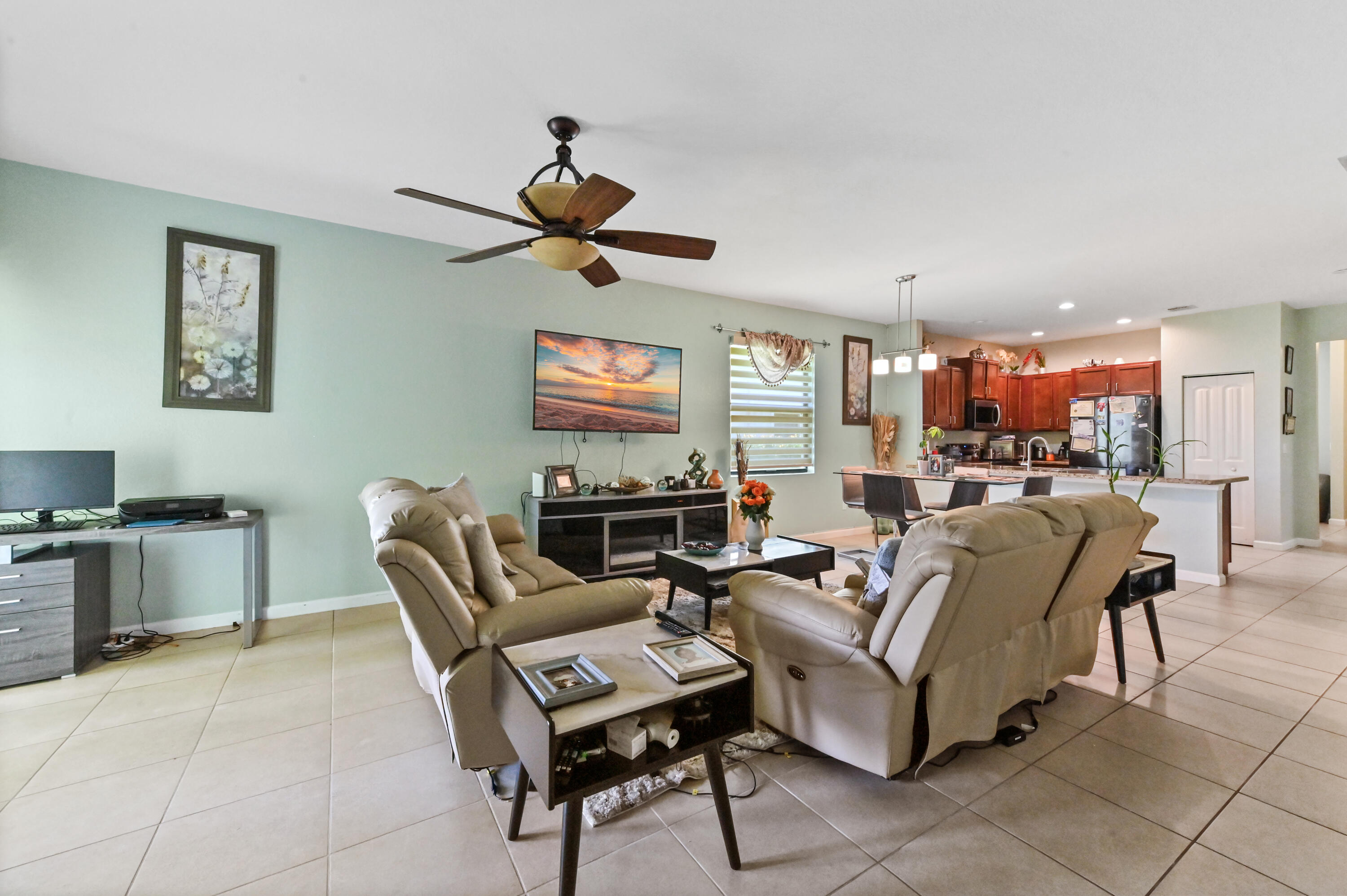 4848 Pond Pine Way Greenacres, FL 33463 - Photo 10 of 14 a living room with furniture and a flat screen tv