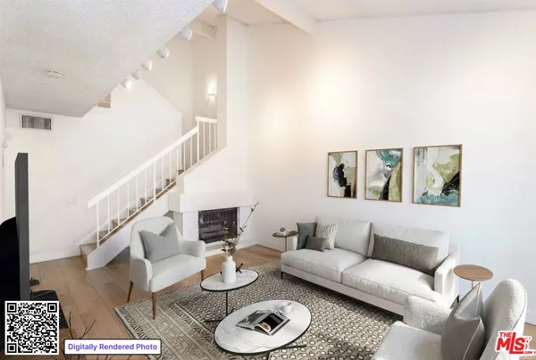 a living room with furniture and a rug