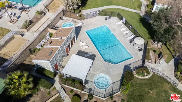 an aerial view of a house with a swimming pool