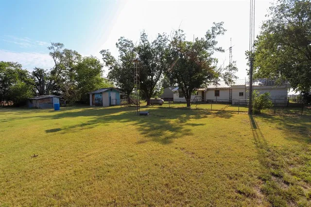 a view of a swimming pool with an outdoor space and seating area