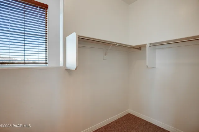 a view of an empty walk in closet
