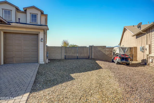 a view of a car park in front of house