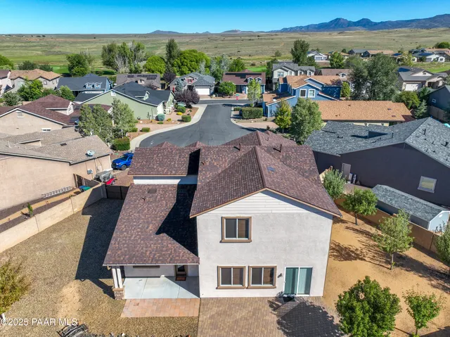 an aerial view of residential houses with outdoor space