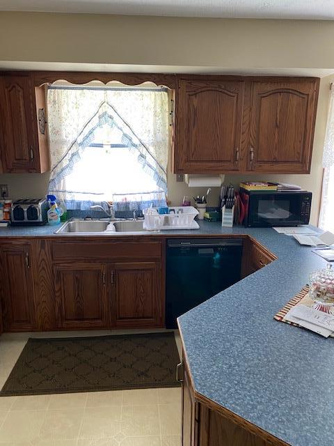 4942 Georgetown Road Franklin, PA 16323 - Photo 12 of 28 a kitchen with a sink a window and cabinets