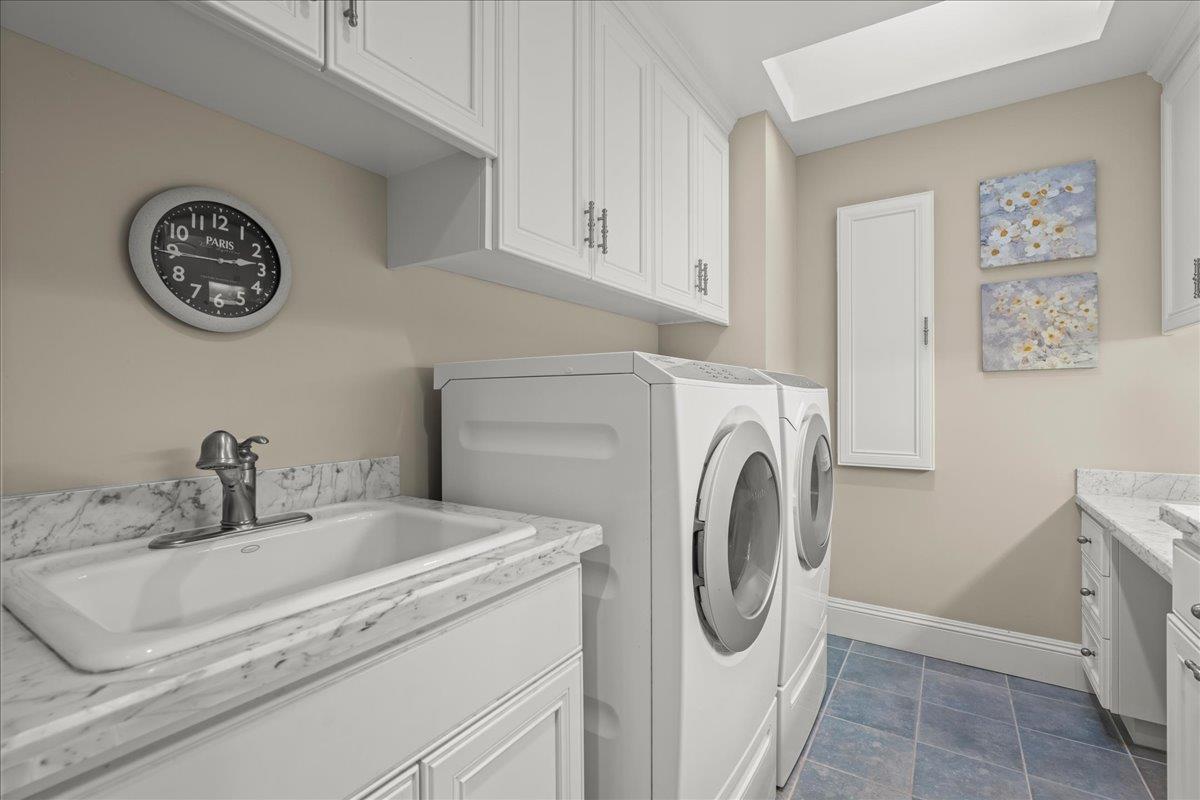 3510 Alpine Road Portola Valley, CA 94028 - Photo 32 of 77 a bathroom with a sink and a washer dryer