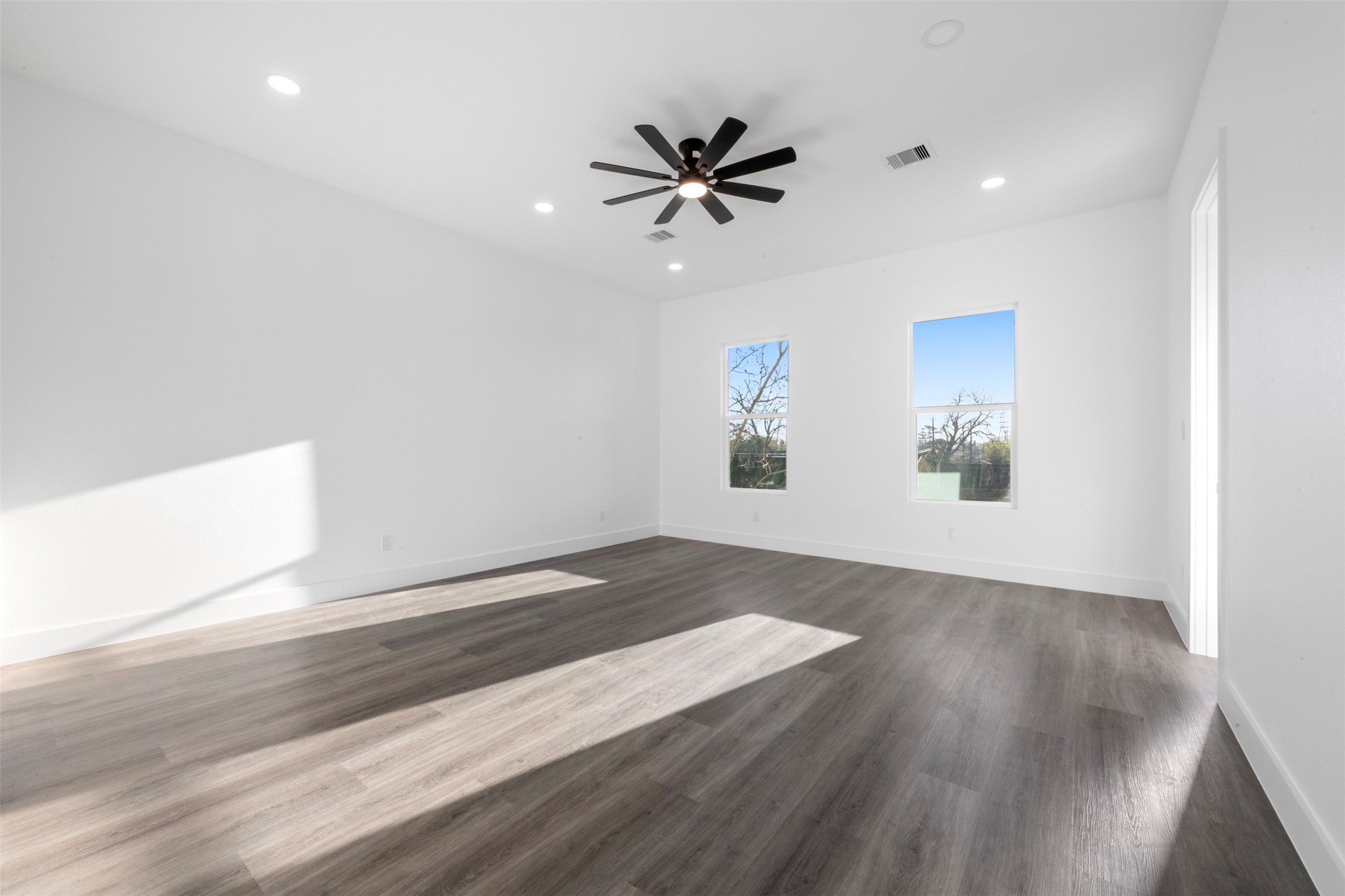 1306 Duff Lane Houston, TX 77022 - Photo 18 of 33 a view of empty room with wooden floor