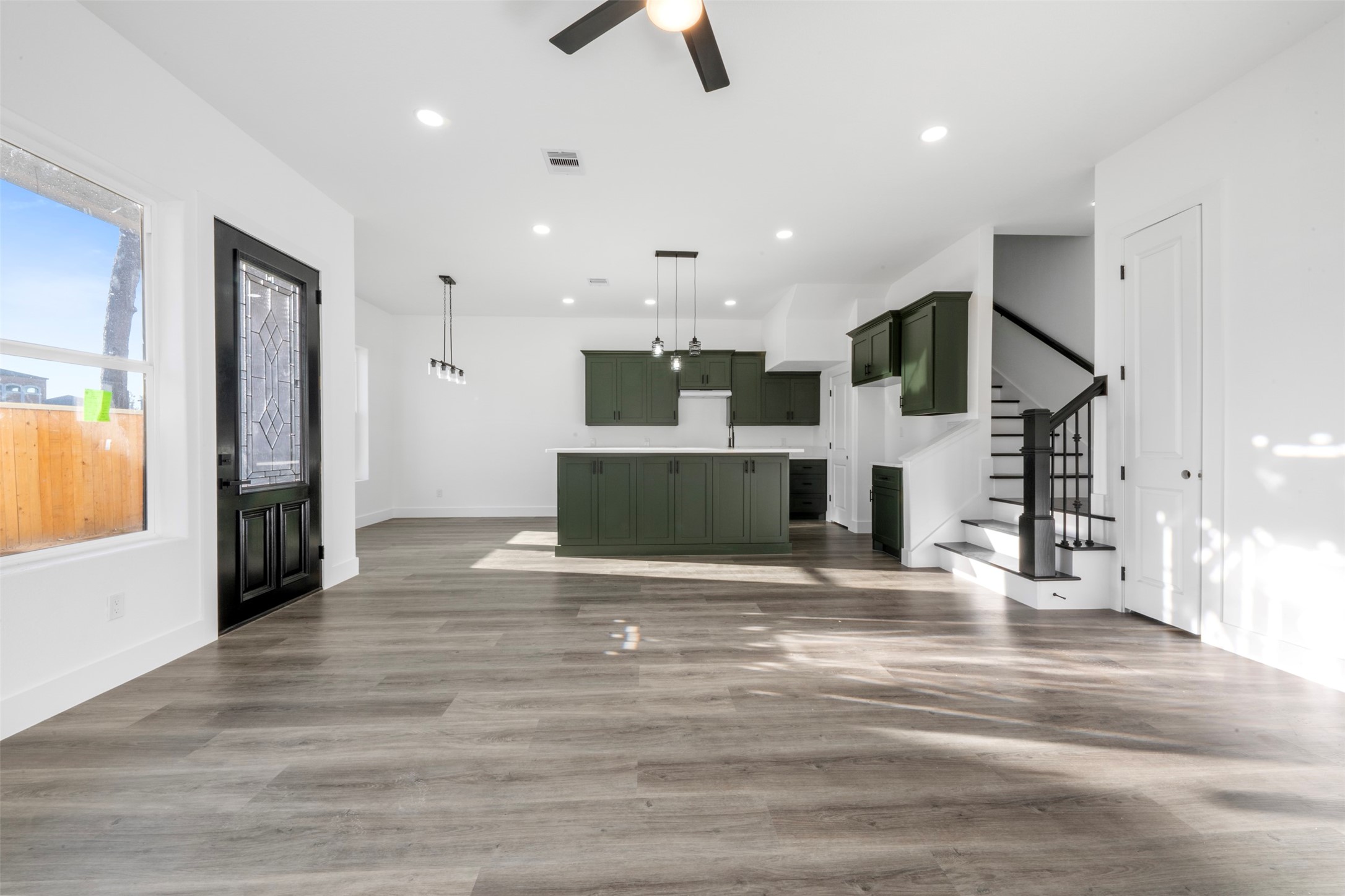1306 Duff Lane Houston, TX 77022 - Photo 6 of 33 an open kitchen with kitchen island and stainless steel appliances