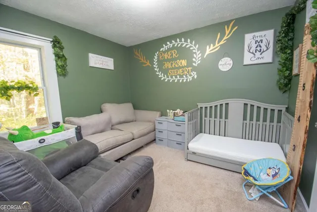 a bedroom with furniture and a window