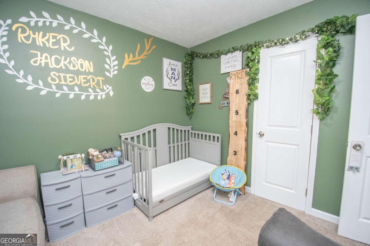 1104 Alverson Road LaGrange, GA 30241 - Photo 20 of 25 a bedroom with a bed and a window