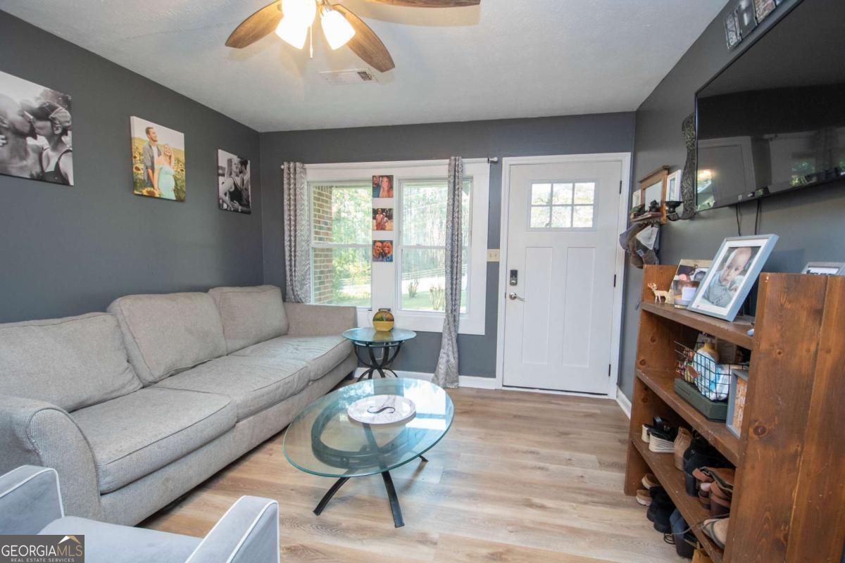 1104 Alverson Road LaGrange, GA 30241 - Photo 5 of 25 a living room with furniture and a wooden floor