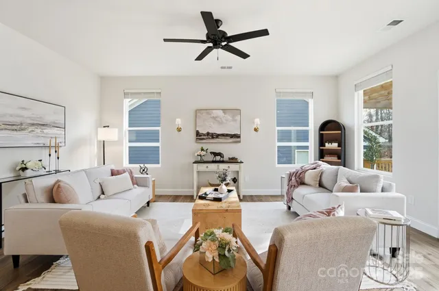 a living room with furniture and a large window
