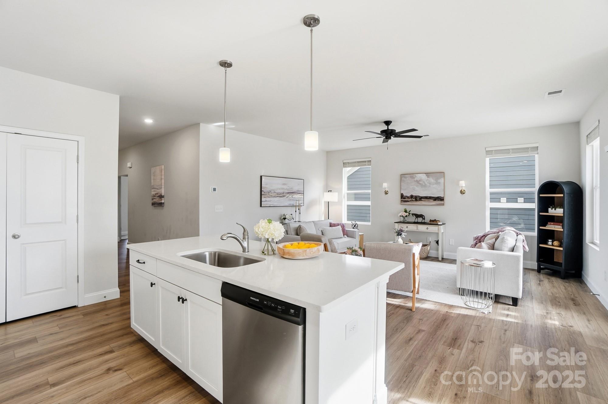 256 Hamrick Road, Unit 12 Cramerton, NC 28056 - Photo 14 of 41 a view of a kitchen with granite countertop a sink and a living room area